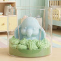 Wickory Dreaming Dumbo handcrafted beeswax baby elephant candle in soft pastel tones, a gentle nursery décor piece and newborn gift made without added fragrance