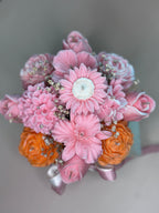 Close-up of Wickory Blossom Garden beeswax flower candles showing richly detailed hand-poured petals and braided wicks in a layered garden-style arrangement