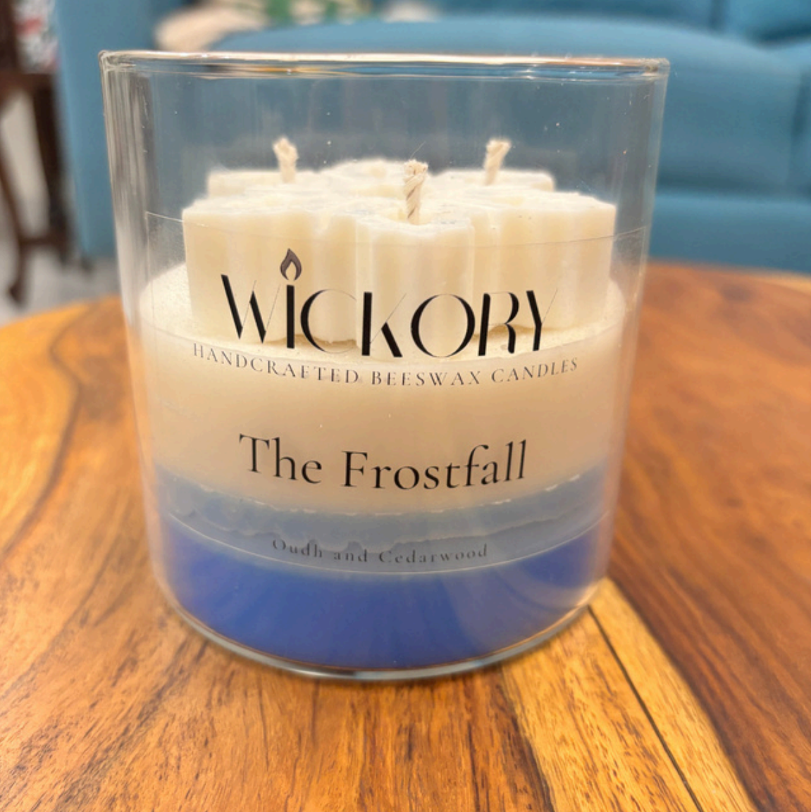 Wickory The Frostfall handcrafted beeswax candle with layered winter-inspired wax design in a clear glass jar, a premium festive candle gift