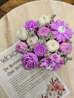 Close-up of Wickory Blossom Posy handcrafted beeswax flower candles showing detailed hand-poured petals in soft pink tones, arranged as a gift-ready floral bouquet