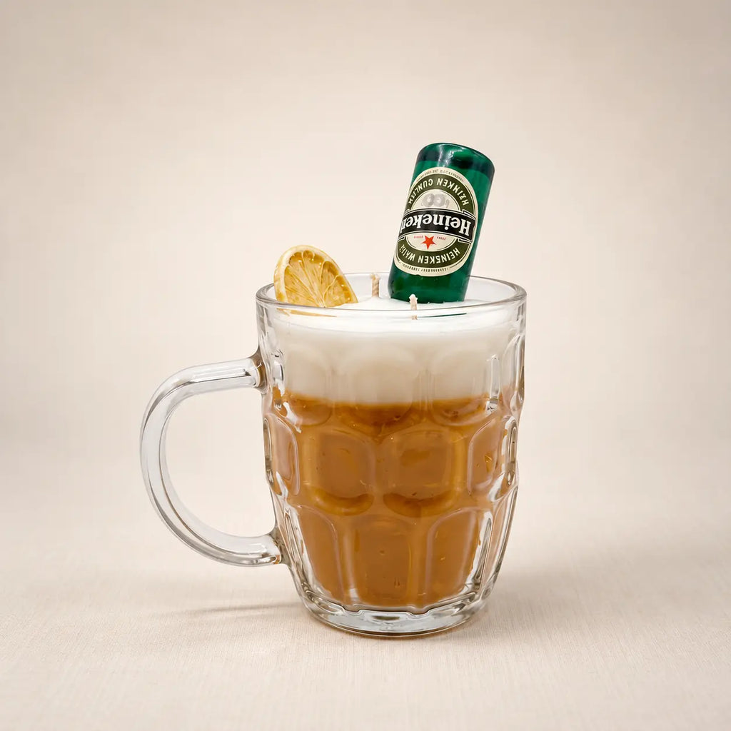 Beer Mug beeswax candle: amber wax and a white foam top in a glass beer mug, with a mini beer bottle and a dried lemon slice