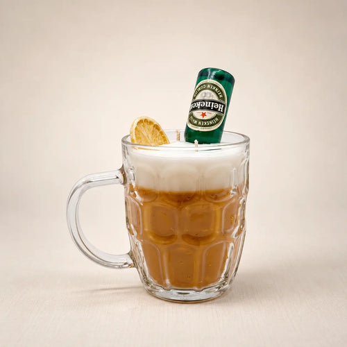 Beer Mug beeswax candle: amber wax and a white foam top in a glass beer mug, with a mini beer bottle and a dried lemon slice