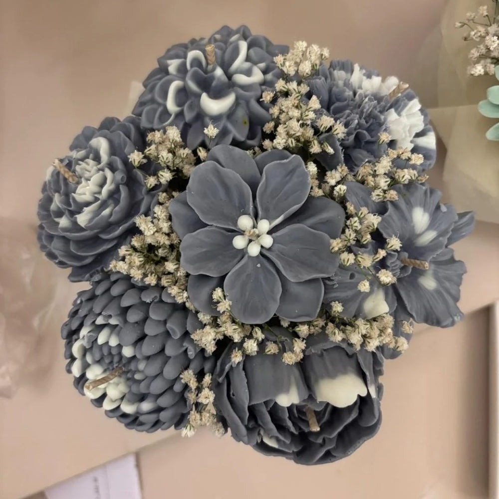 The Blossom Bunch in muted blue-grey and white sculpted wax flowers with small cream filler blossoms