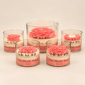 The Blush Petal: five pink flower-topped jar candles in small and large sizes, each labelled