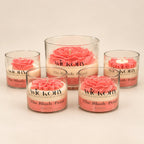 The Blush Petal: five pink flower-topped jar candles in small and large sizes, each labelled