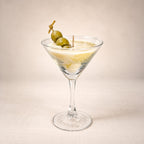 Dirty Martini beeswax candle: ivory wax in a martini glass with green olives on a skewer