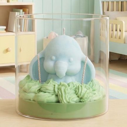 Wickory Dreaming Dumbo handcrafted beeswax baby elephant candle in soft pastel tones, a gentle nursery décor piece and newborn gift made without added fragrance