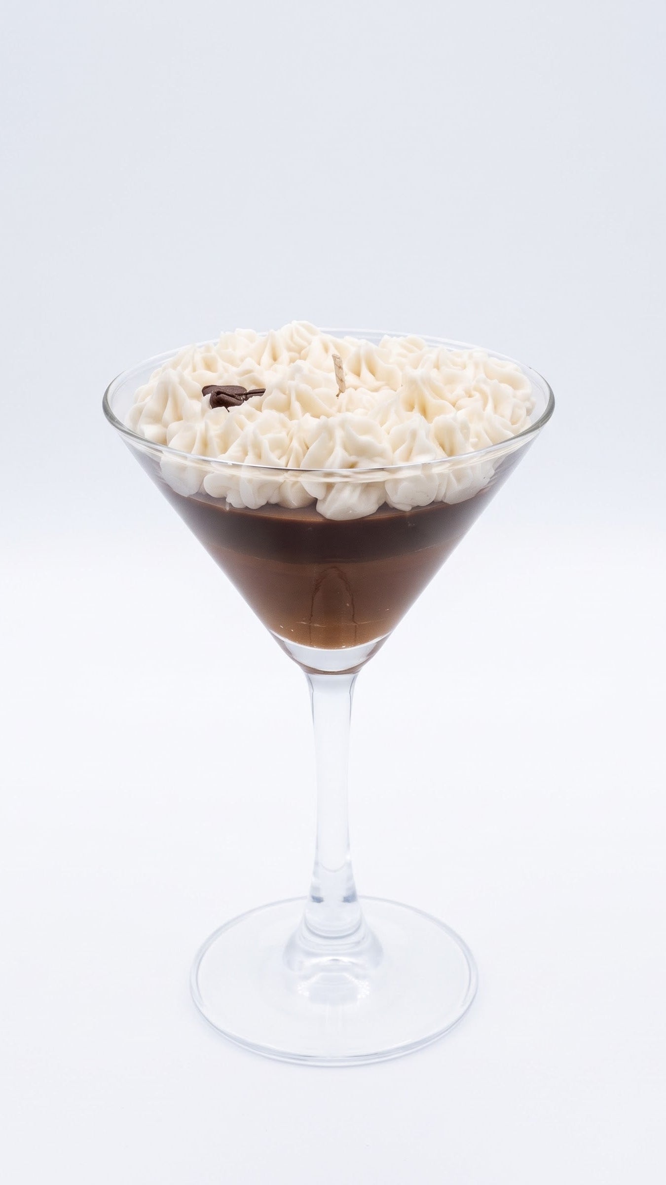 Wickory Espresso Martini beeswax candle, with deep coffee-toned wax, a creamy foam swirl and whole coffee beans set in a martini glass