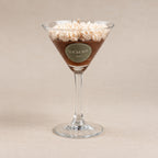 Espresso Martini cocktail-inspired candle in a martini glass with whipped cream topping