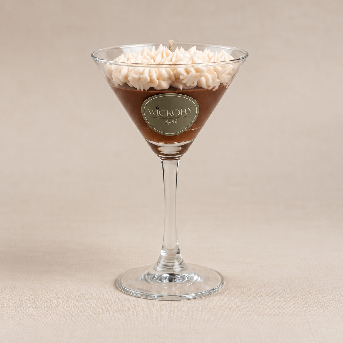 Espresso Martini cocktail-inspired candle in a martini glass with whipped cream topping