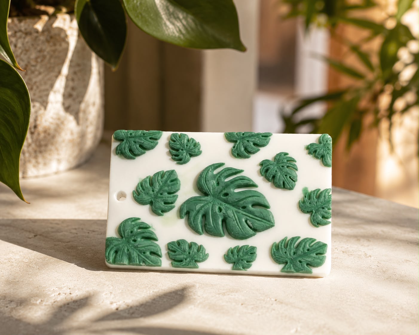 Monstera wax sachet showing the sculpted leaf detail on handcrafted beeswax