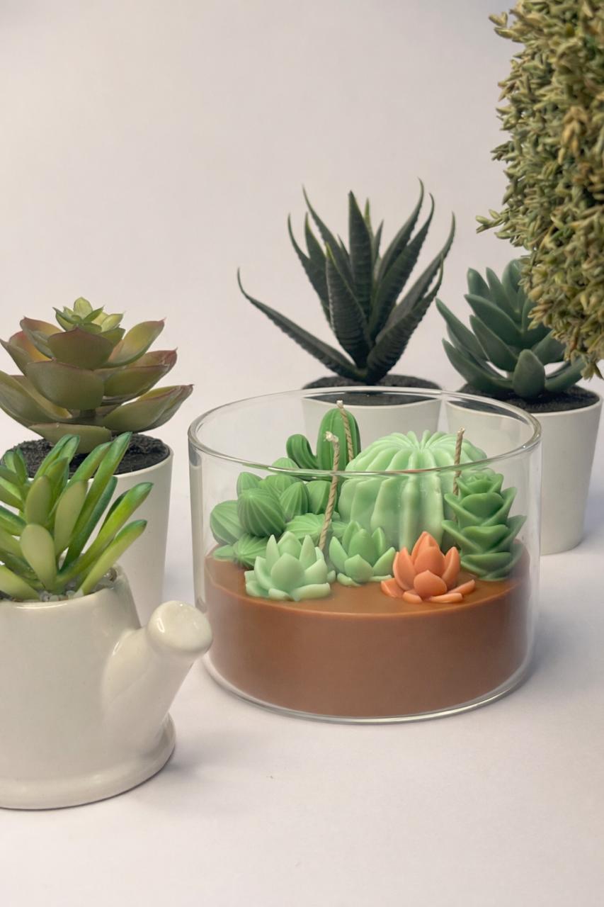 The Succulent Garden: Wickory handcrafted beeswax candle with sculpted green cacti and succulents on a terracotta wax base in a clear borosilicate jar