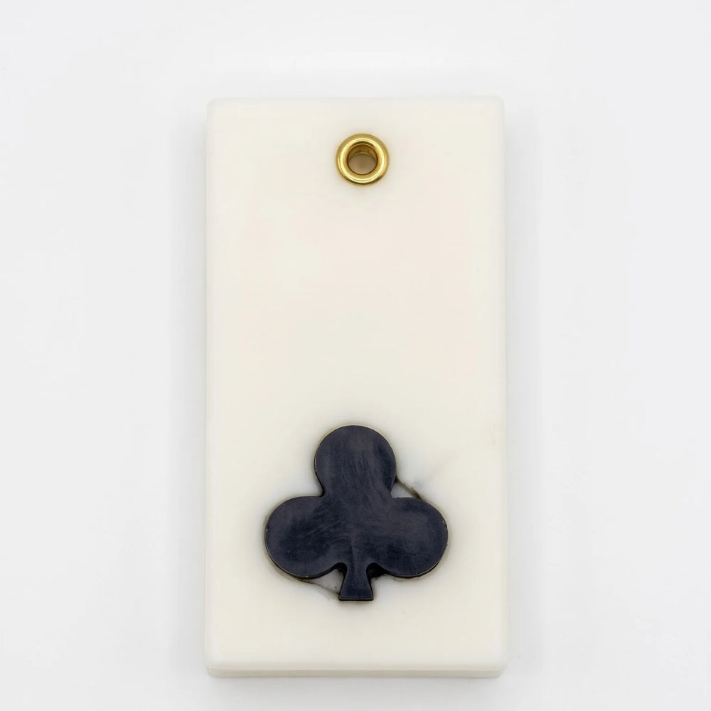 Teen Patti wax sachet with a sculpted black club symbol