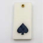 Teen Patti wax sachet with a sculpted black spade symbol