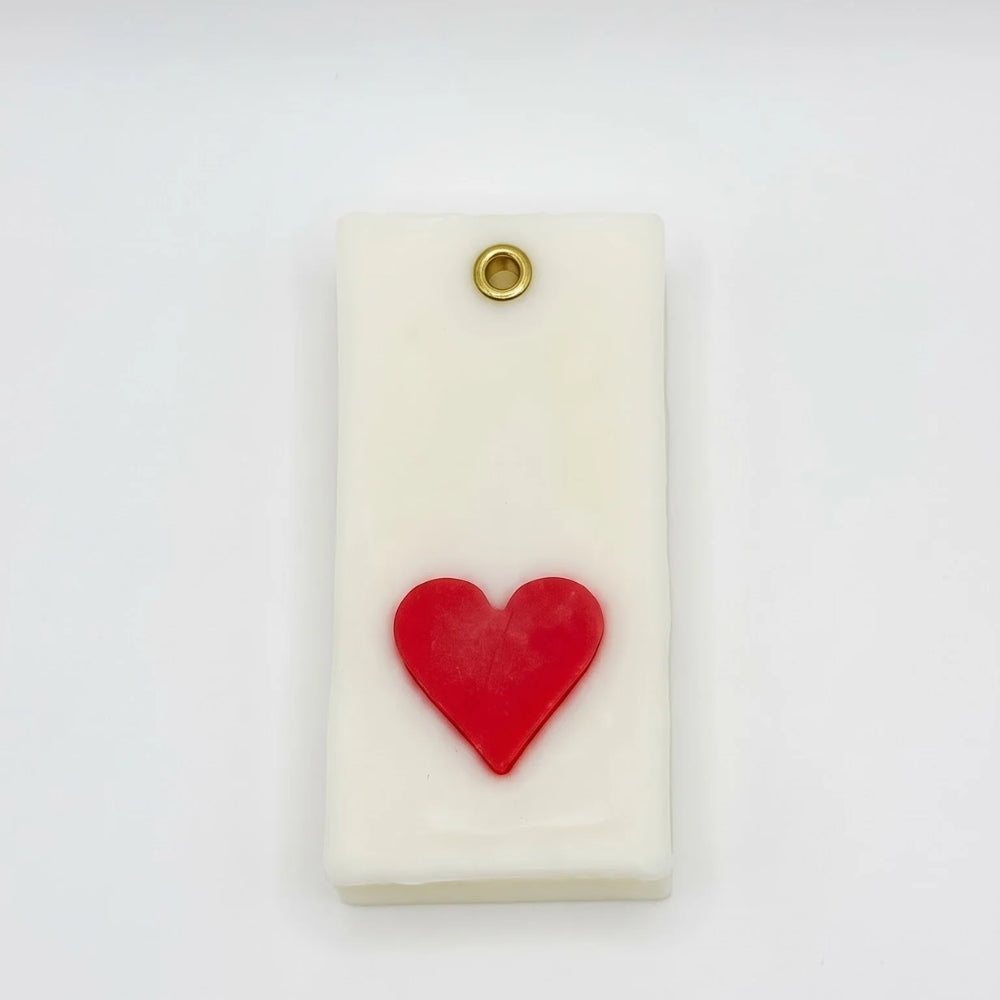 Teen Patti wax sachet with a sculpted red heart symbol