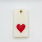 Teen Patti wax sachet with a sculpted red heart symbol