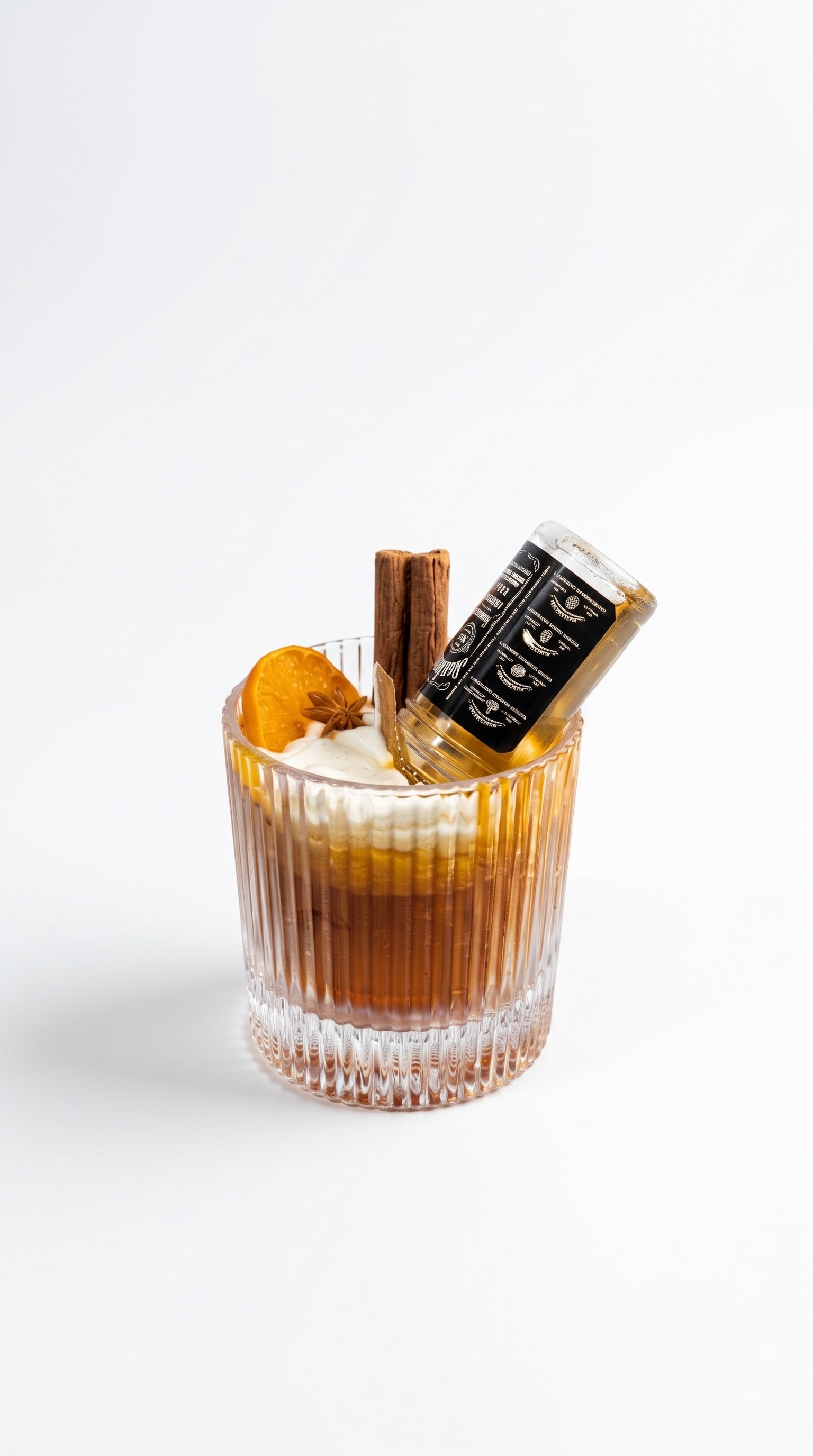 Wickory Whiskey Sour beeswax candle in a ribbed rocks glass, rich amber wax finished with a sculpted orange wheel
